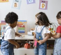 Young children playing with educational toys